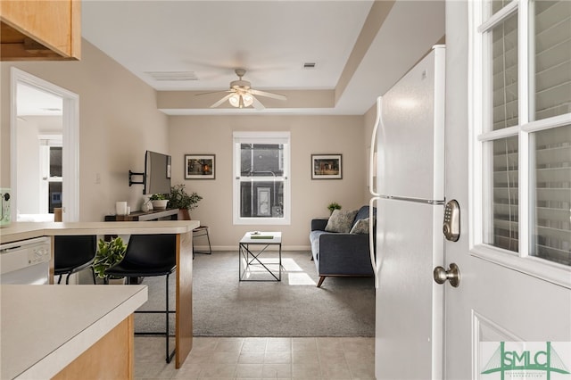 interior space with ceiling fan