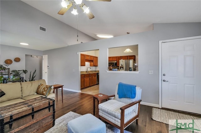 living room featuring ceiling fan, sink, dark hardwood / wood-style flooring, and lofted ceiling