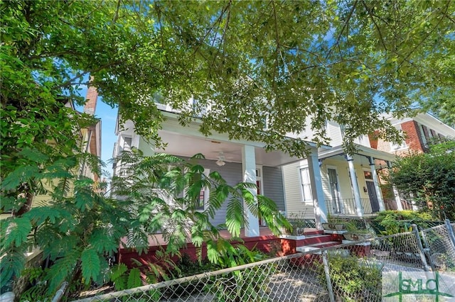 view of side of property featuring a porch