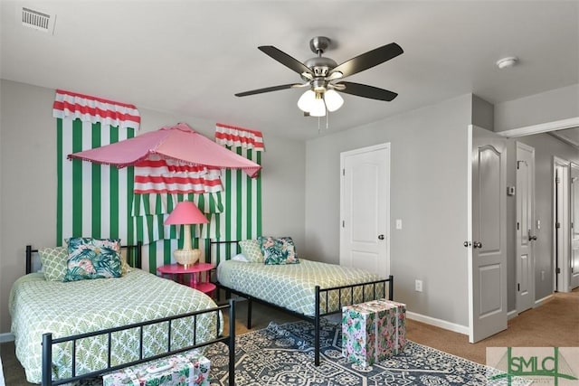 carpeted bedroom featuring ceiling fan