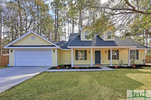 view of front of property featuring a front lawn, a porch, and a garage