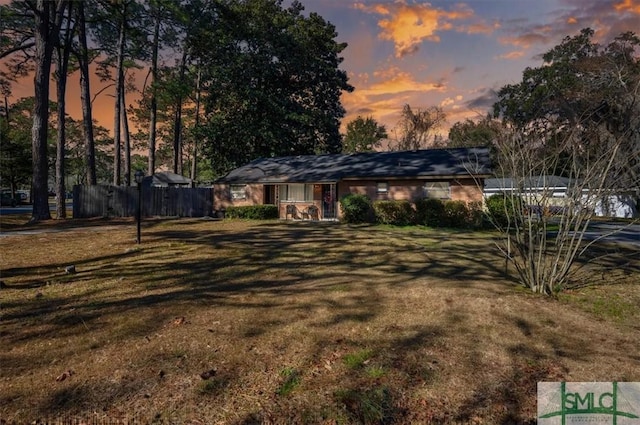 view of front of home featuring a yard