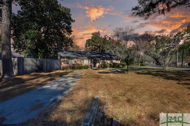 view of front of home with a lawn