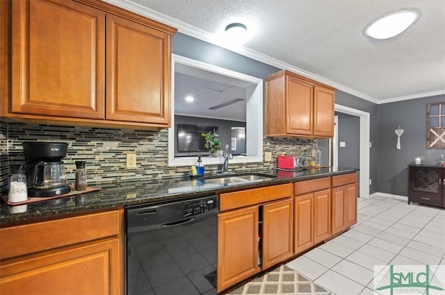 kitchen with black dishwasher, dark stone countertops, tasteful backsplash, and sink