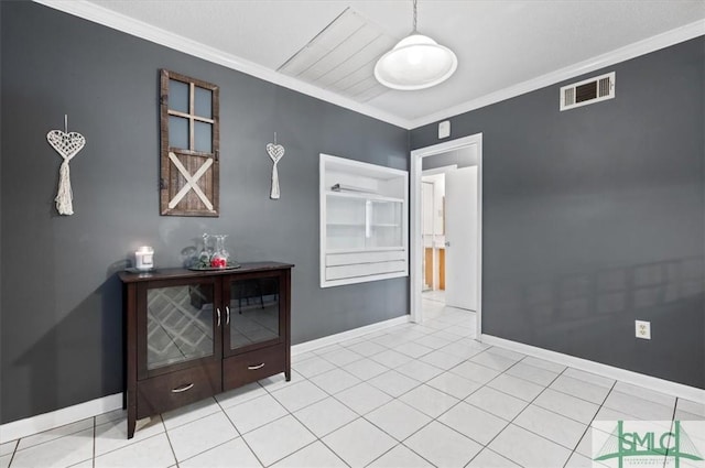 interior space featuring built in features, ornamental molding, and light tile patterned flooring