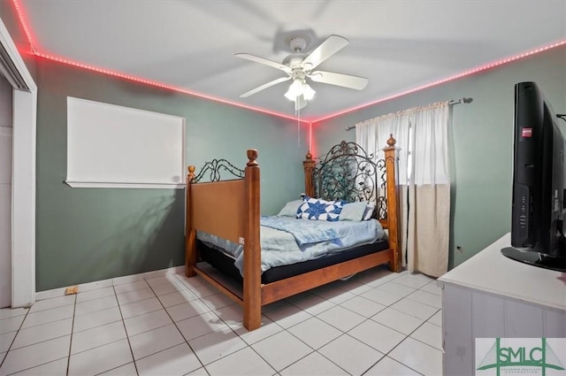 bedroom with ceiling fan and light tile patterned floors