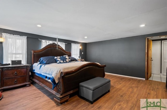 bedroom with light hardwood / wood-style floors