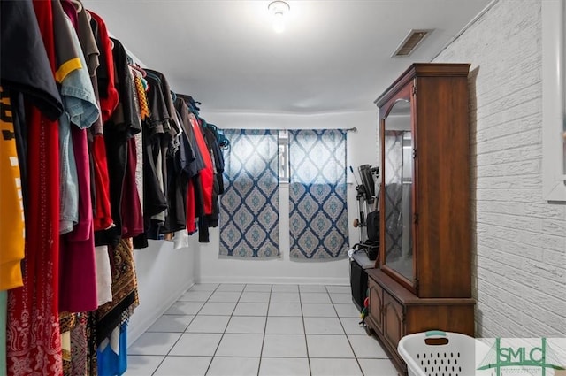 spacious closet featuring light tile patterned floors