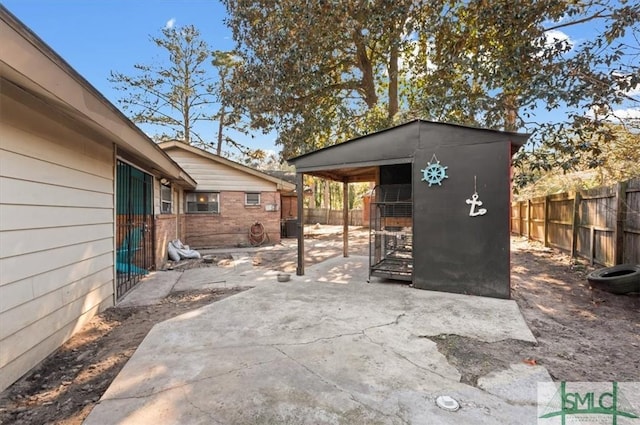 view of patio / terrace with central AC and an outdoor structure