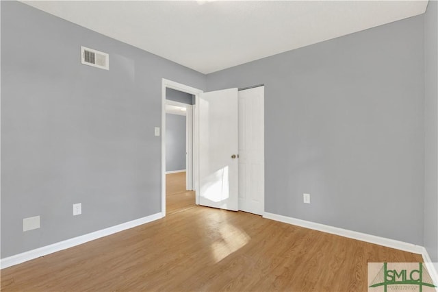 empty room featuring hardwood / wood-style floors