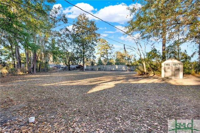 view of yard featuring a storage unit