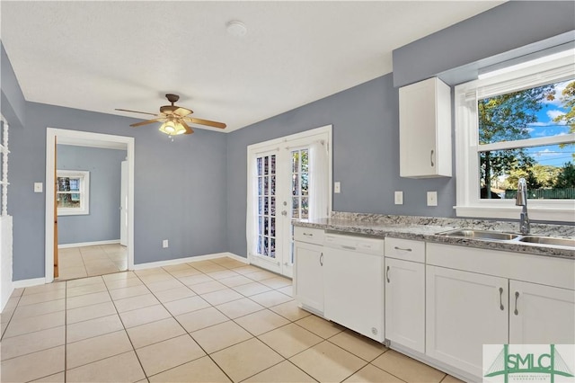 kitchen with dishwasher, white cabinetry, french doors, sink, and ceiling fan