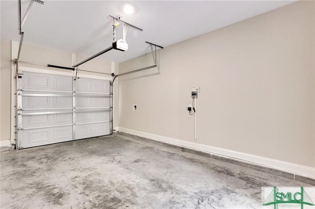 garage with baseboards and a garage door opener