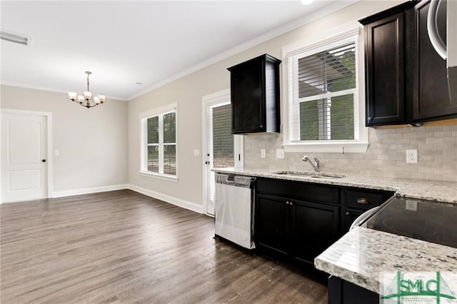 kitchen featuring crown molding, visible vents, hanging light fixtures, stainless steel dishwasher, and a sink