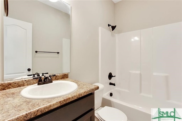 bathroom with shower / bath combination, toilet, and vanity