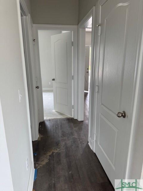 corridor featuring wood finished floors