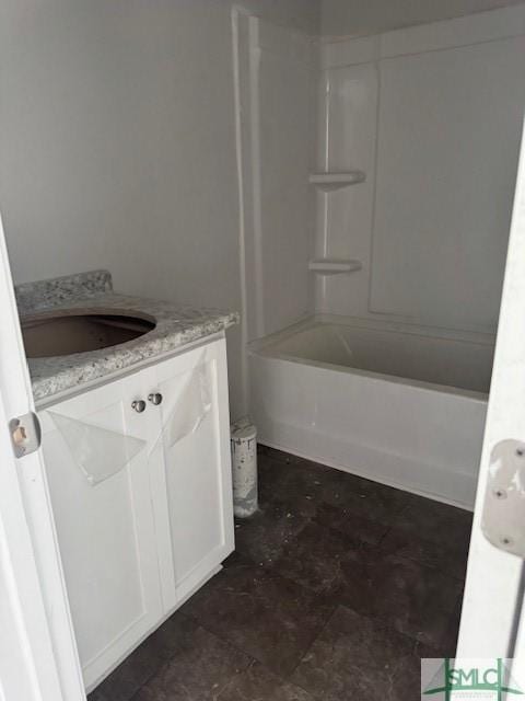 bathroom featuring vanity and bathing tub / shower combination