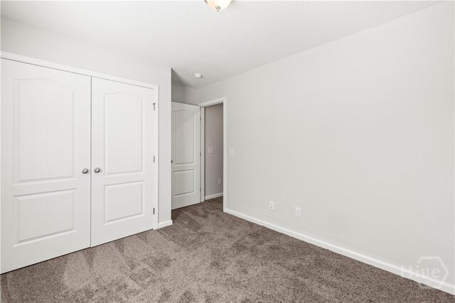 57 Oakmont Dr, Guyton, GA 31312 - unfurnished bedroom featuring carpet flooring, a closet, and baseboards