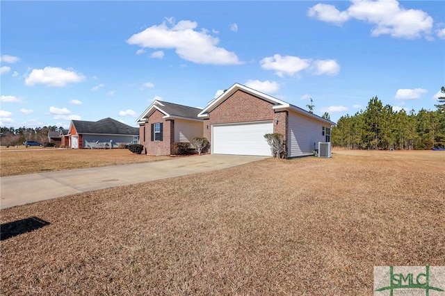 single story home with a front yard, central AC unit, and a garage