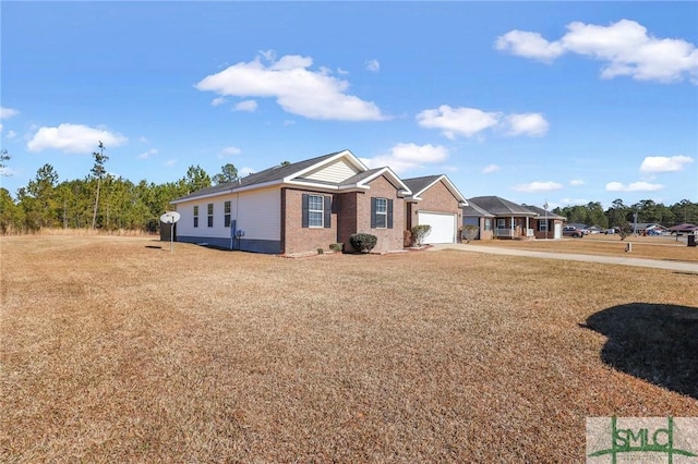 single story home with a garage and a front yard