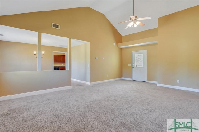 empty room with ceiling fan, high vaulted ceiling, and light carpet