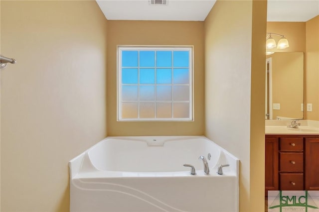 bathroom featuring vanity and a bathing tub