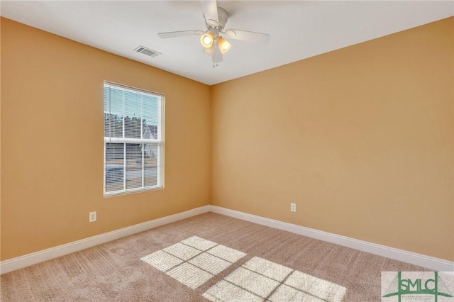 carpeted empty room featuring ceiling fan