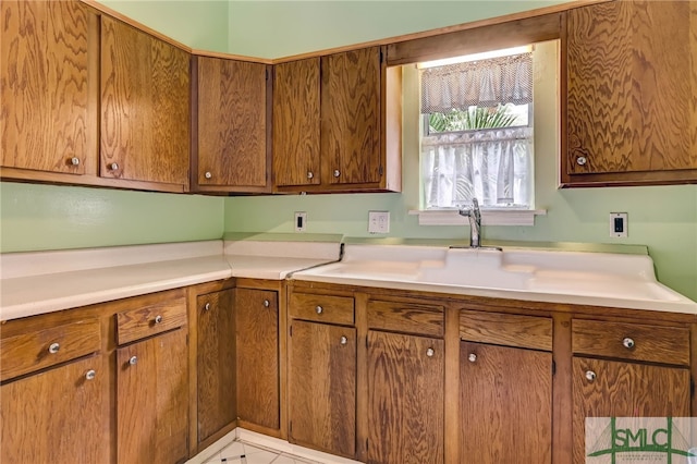 kitchen with light tile patterned flooring