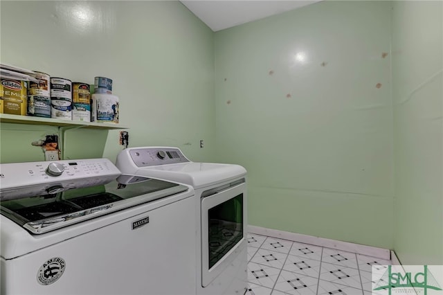 clothes washing area with washing machine and clothes dryer