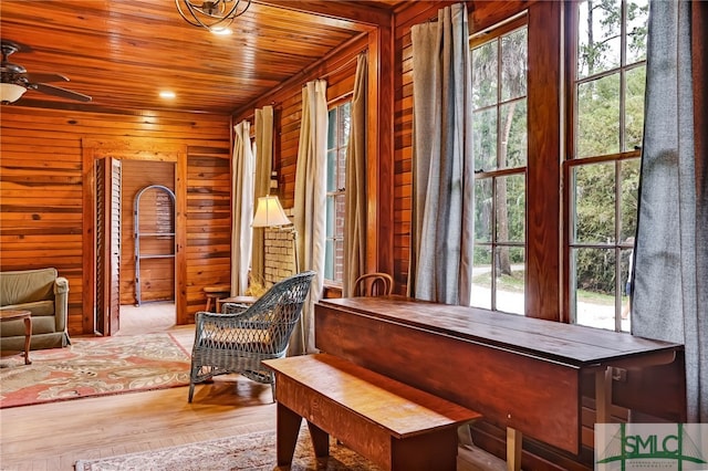 sitting room with ceiling fan, wood ceiling, and hardwood / wood-style floors