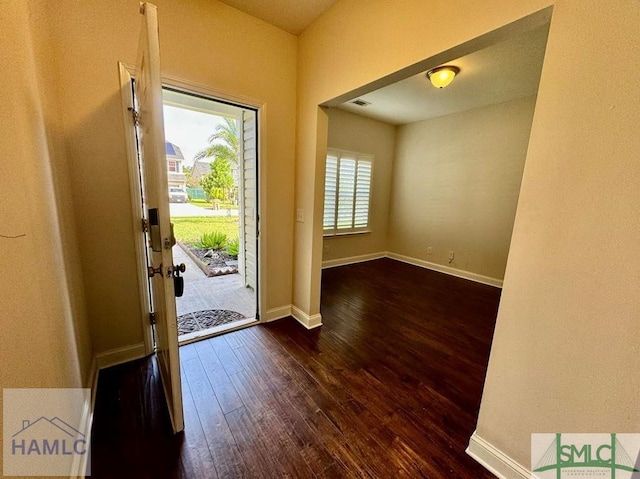 foyer entrance with dark wood-type flooring