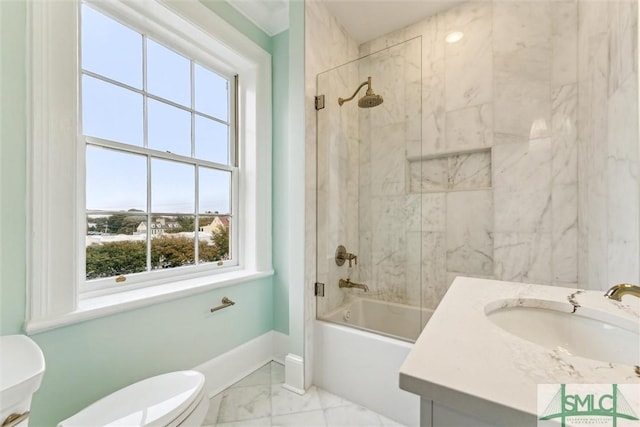 full bathroom with vanity, a wealth of natural light, toilet, and tiled shower / bath