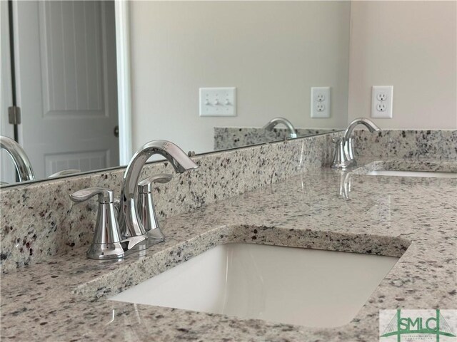 interior details featuring decorative backsplash and vanity