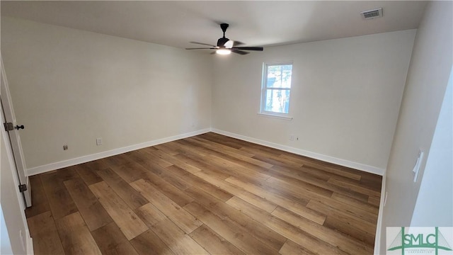 spare room with ceiling fan and wood-type flooring