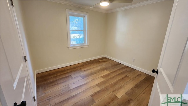 unfurnished room featuring light hardwood / wood-style floors, ornamental molding, and ceiling fan