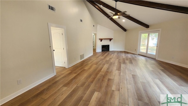 unfurnished living room with ceiling fan, light hardwood / wood-style flooring, high vaulted ceiling, and beamed ceiling