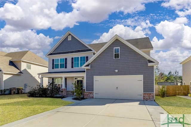 craftsman inspired home with a front yard, a garage, and a porch