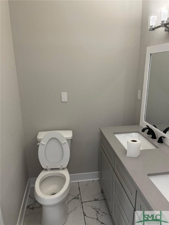 bathroom with toilet and vanity