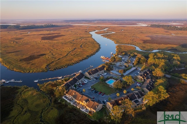 aerial view at dusk with a water view