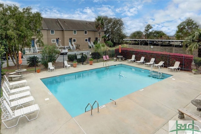 view of swimming pool featuring a patio area