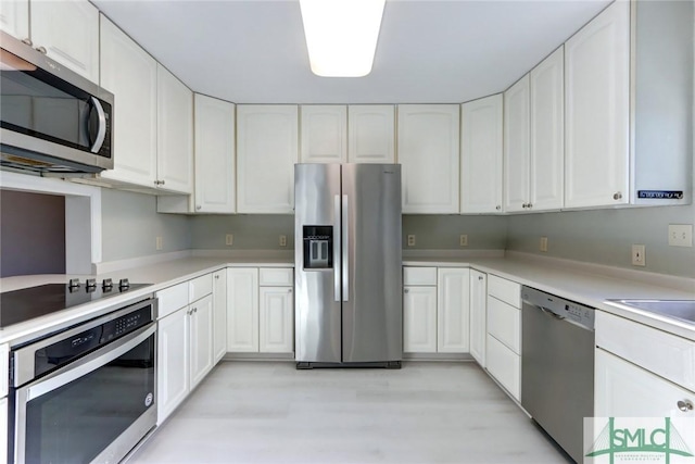 kitchen featuring white cabinets, sink, and stainless steel appliances