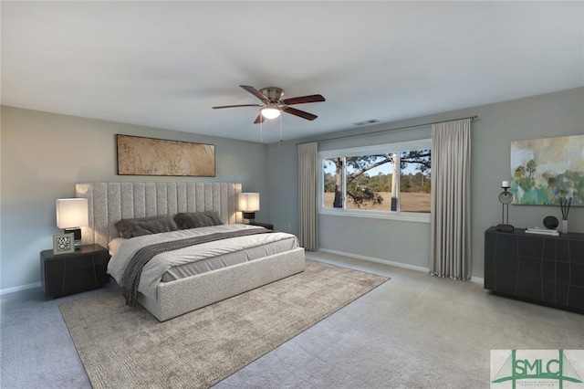 bedroom with ceiling fan and light colored carpet