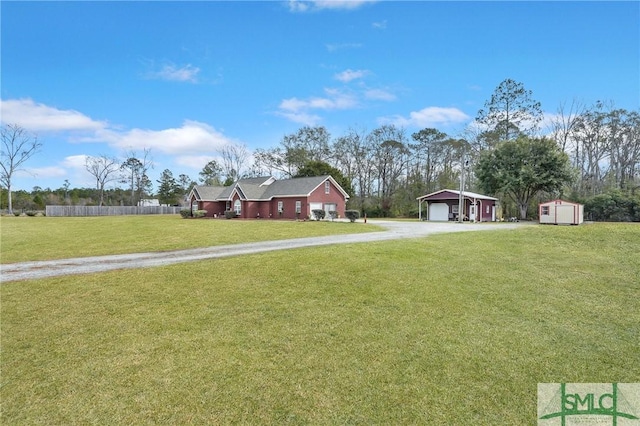 view of yard featuring a shed and a garage