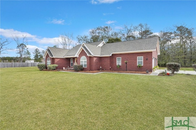 single story home featuring a front yard