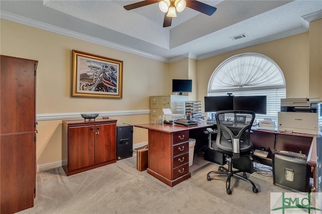 home office featuring light carpet, a textured ceiling, crown molding, and ceiling fan