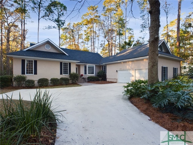 ranch-style house featuring a garage