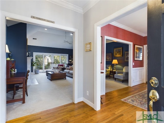 hallway with crown molding and wood-type flooring