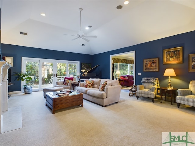 carpeted living room featuring ceiling fan, plenty of natural light, french doors, and vaulted ceiling