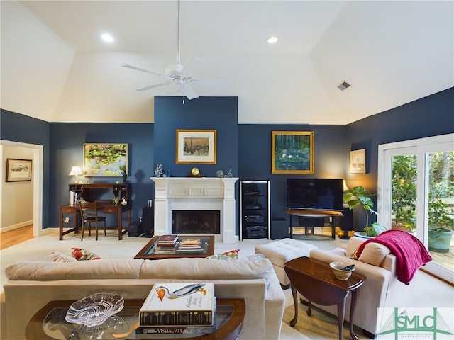 living room with ceiling fan and lofted ceiling