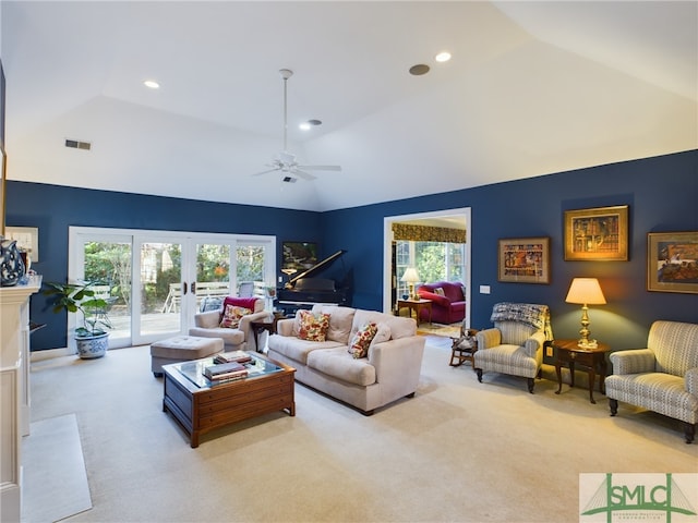 living room with ceiling fan, light carpet, lofted ceiling, and french doors